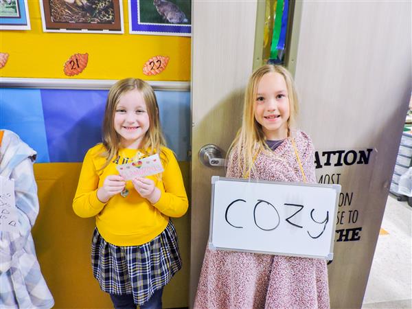 Students and teachers dressing up for a vocabulary parade. 